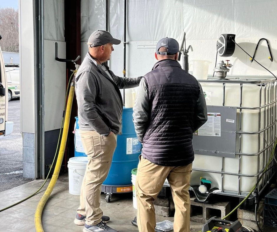 ohDEER founder kurt upham and ohDEER north middlesex owner bob gaska looking at product tank 