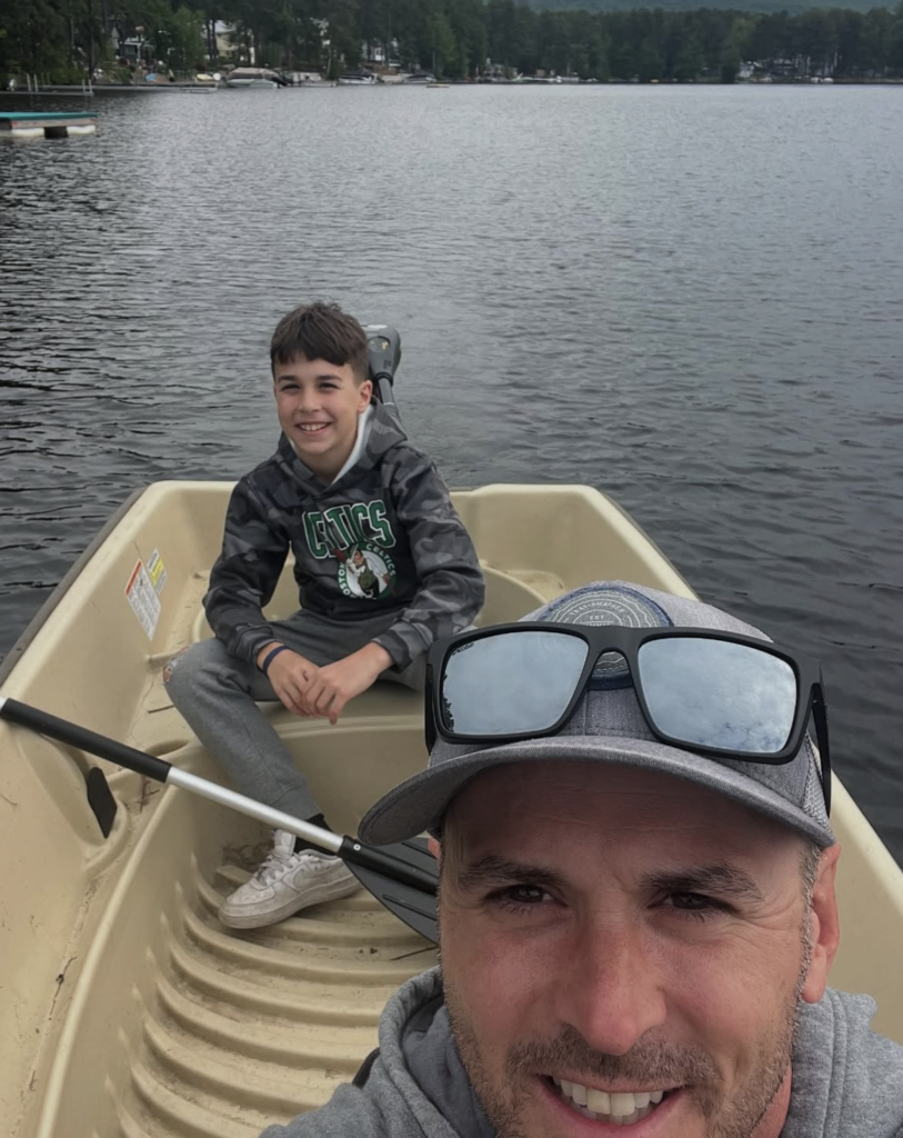 Bob Gaska and son fishing in boat 