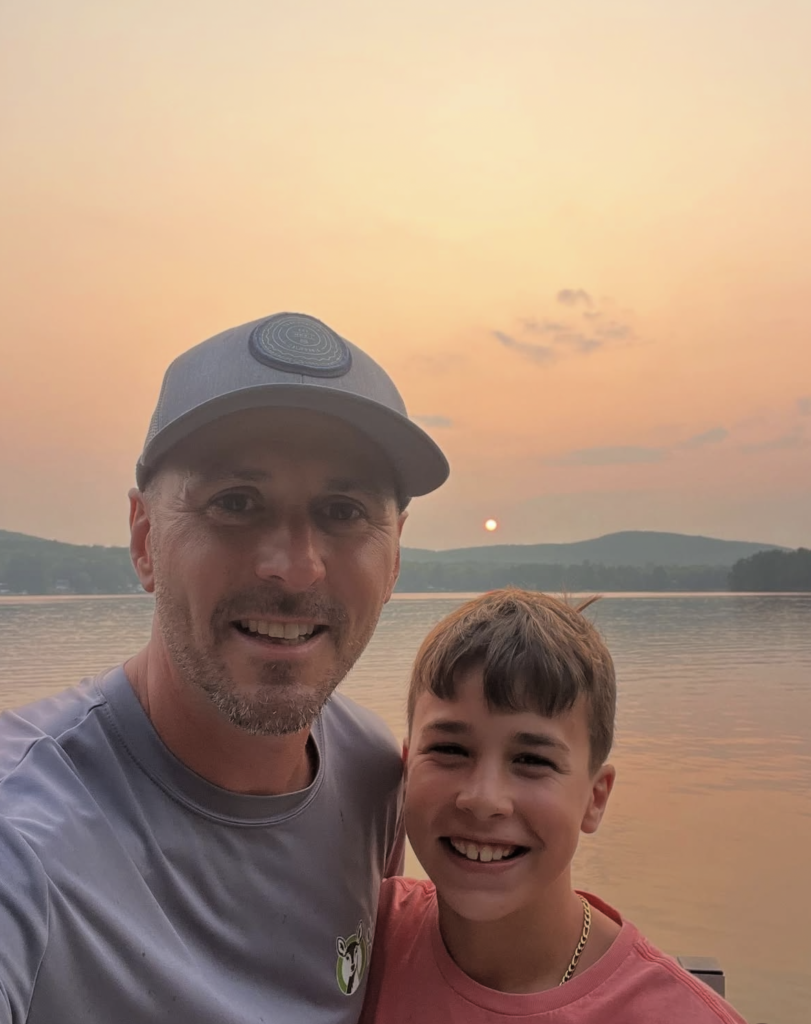 Bob Gaska and son selfie in front of sunset 