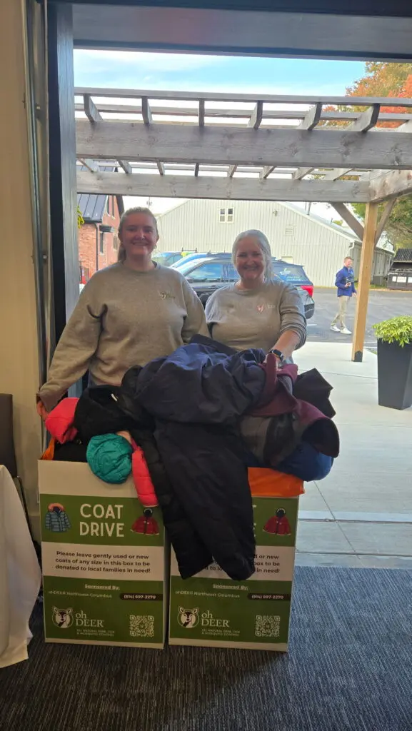 ohDEER Northwest Columbus owners Jeri and Sarah Lucco with coat drive donation boxes 