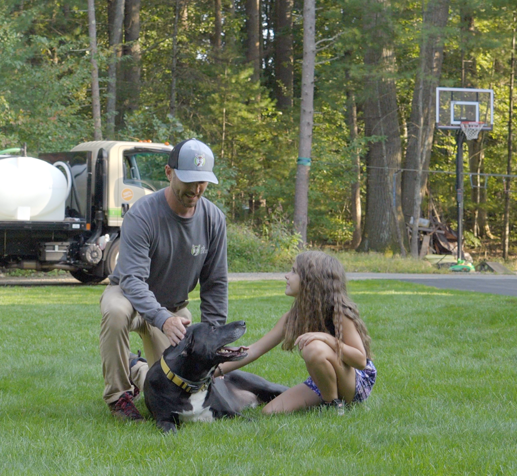 bob gaska in yard with daughter and dog 