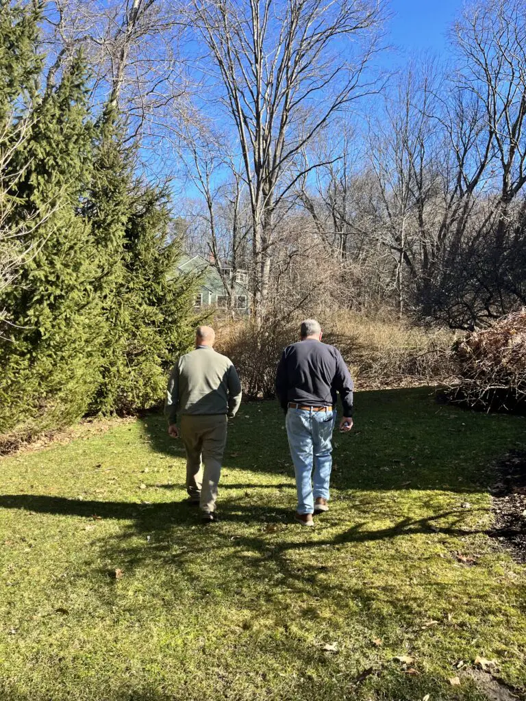 ohDEER Metro West owner Kurt Upham talking with a customer on their property, AI-proof franchise opportunity