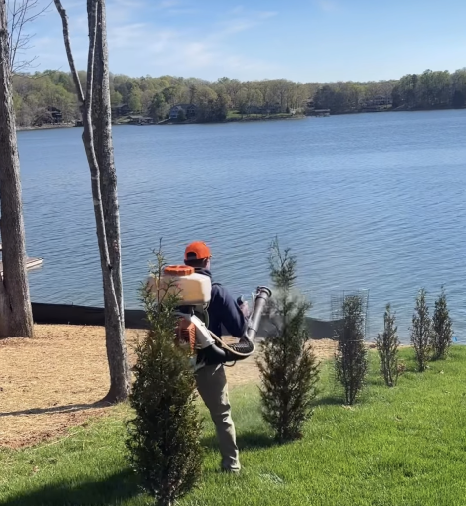 spraying all natural deer control at property on the water