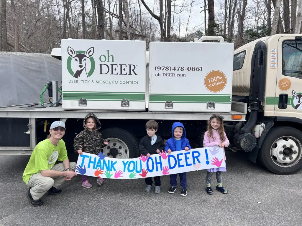 ohDEER technician with preschool kids with thank you sign they made 