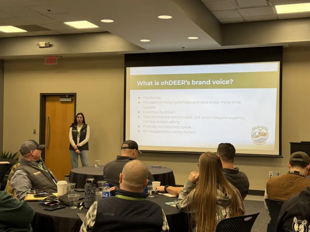 Franchise marketing coordinator presenting at annual event 