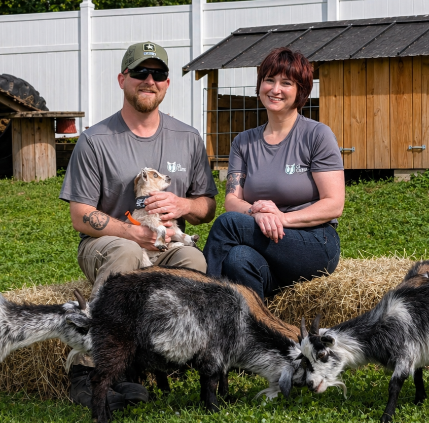 brandi burns and earl neumann with their goats